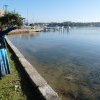 Karen Maber pointing out Carrs Park across Kogarah Bay